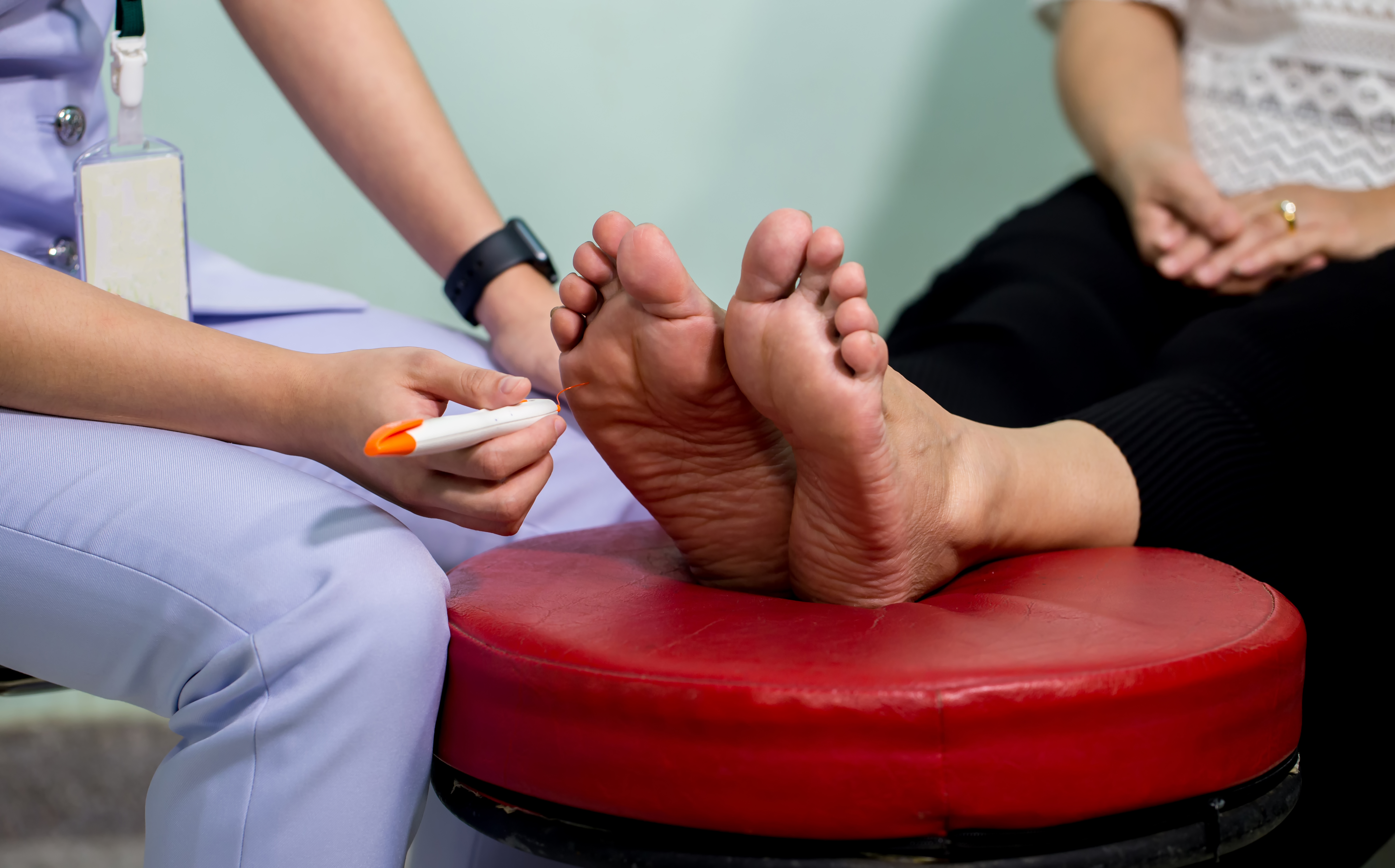 Doctor examines feet